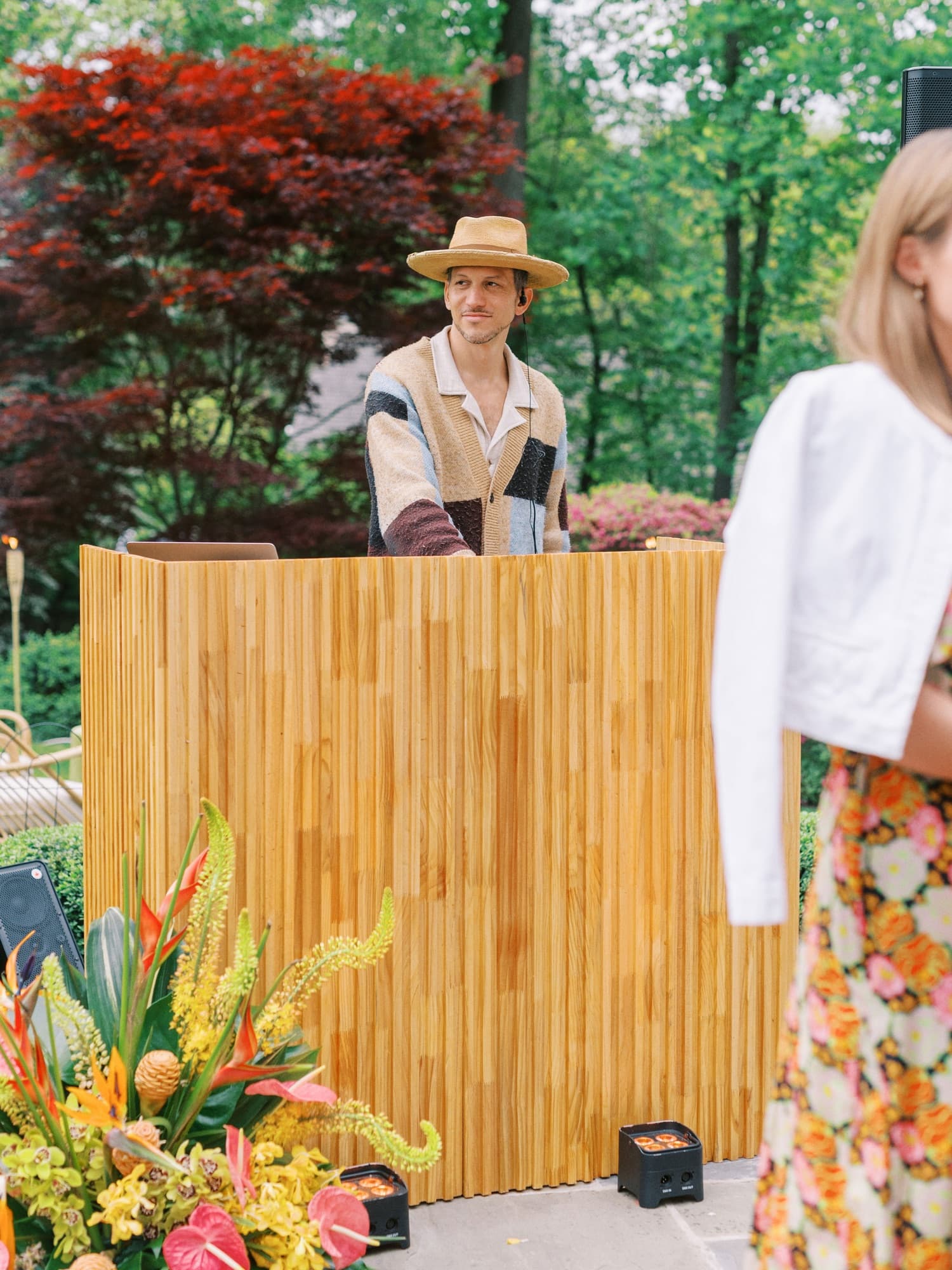 Honeywood DJ booth with a DJ, patio setup